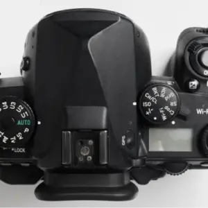 Hand holding photo camera